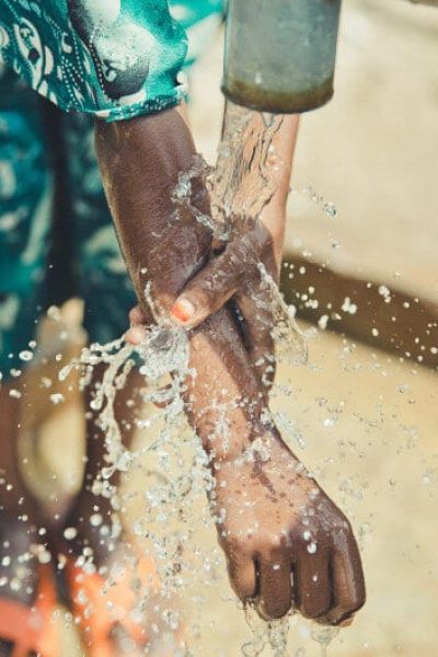 African child washes with water donated by Neven Subotic