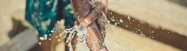 African child washes with water donated by Neven Subotic